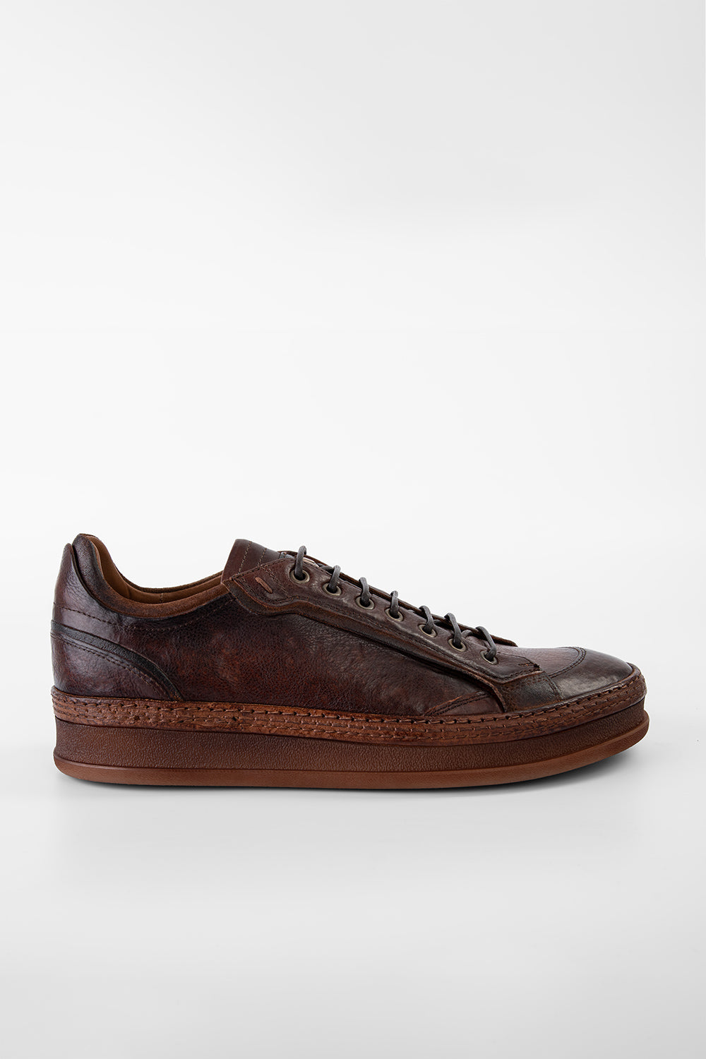 COLE cognac welted distressed sneakers.