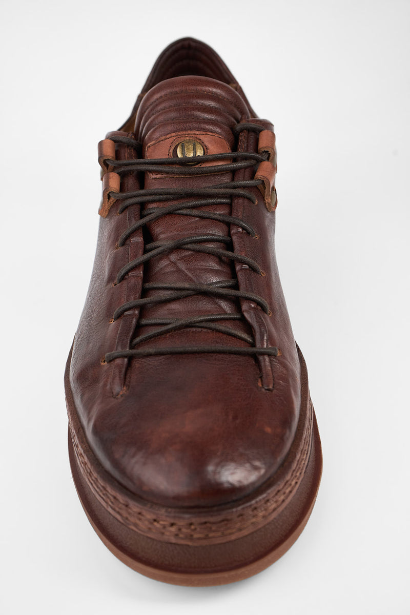 COLE cognac welted distressed loop sneakers.