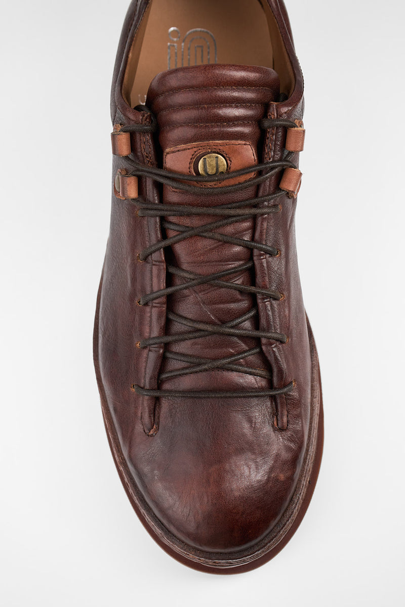 COLE cognac welted distressed loop sneakers.