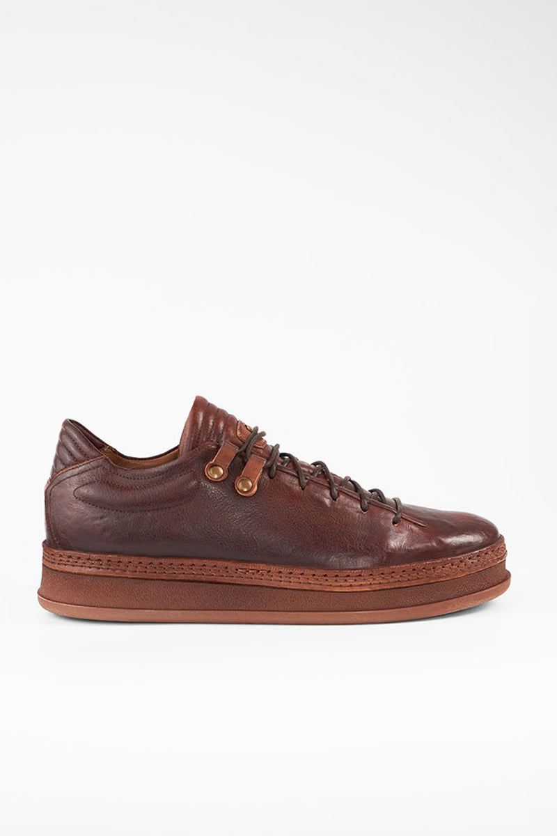 COLE cognac welted distressed loop sneakers.