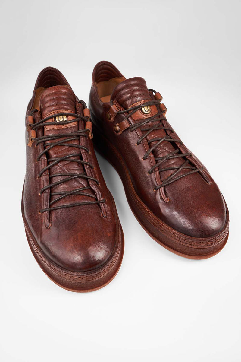 COLE cognac welted distressed loop sneakers.