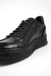 COLE rugged-black welted distressed sneakers.