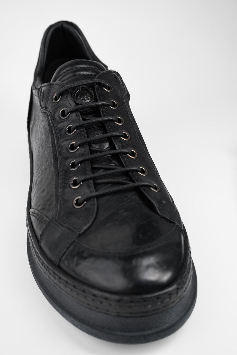 COLE rugged-black welted distressed sneakers.