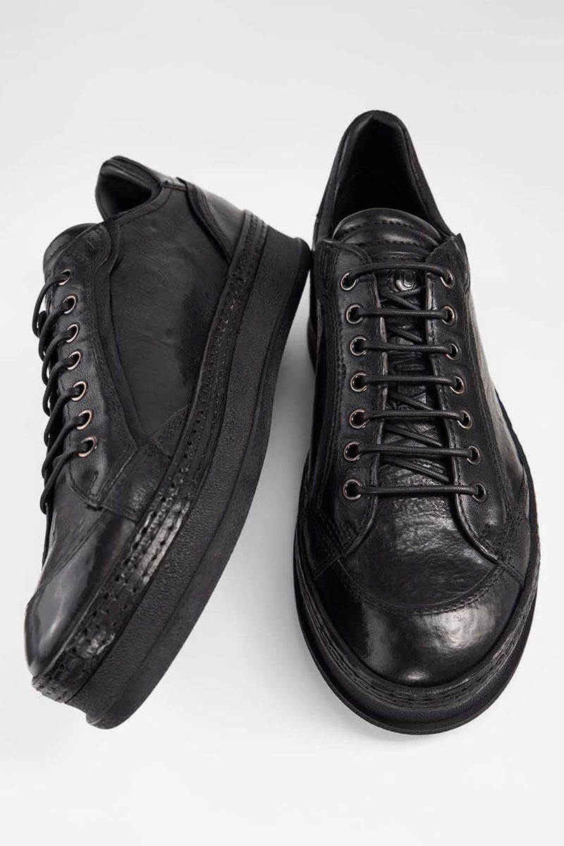 COLE rugged-black welted distressed sneakers.