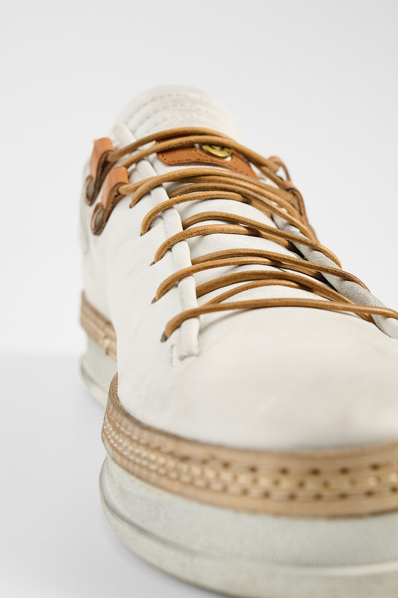 COLE white welted distressed loop sneakers.