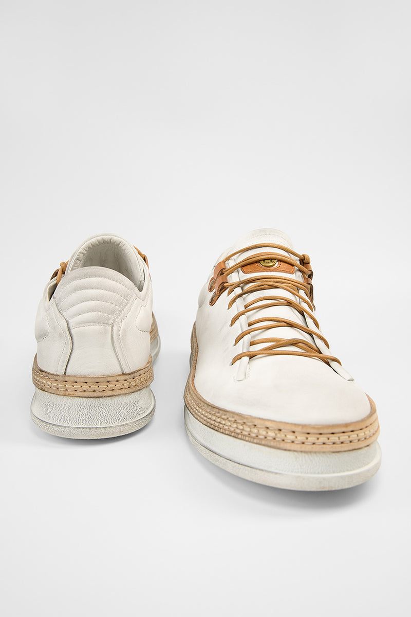 COLE white welted distressed loop sneakers.