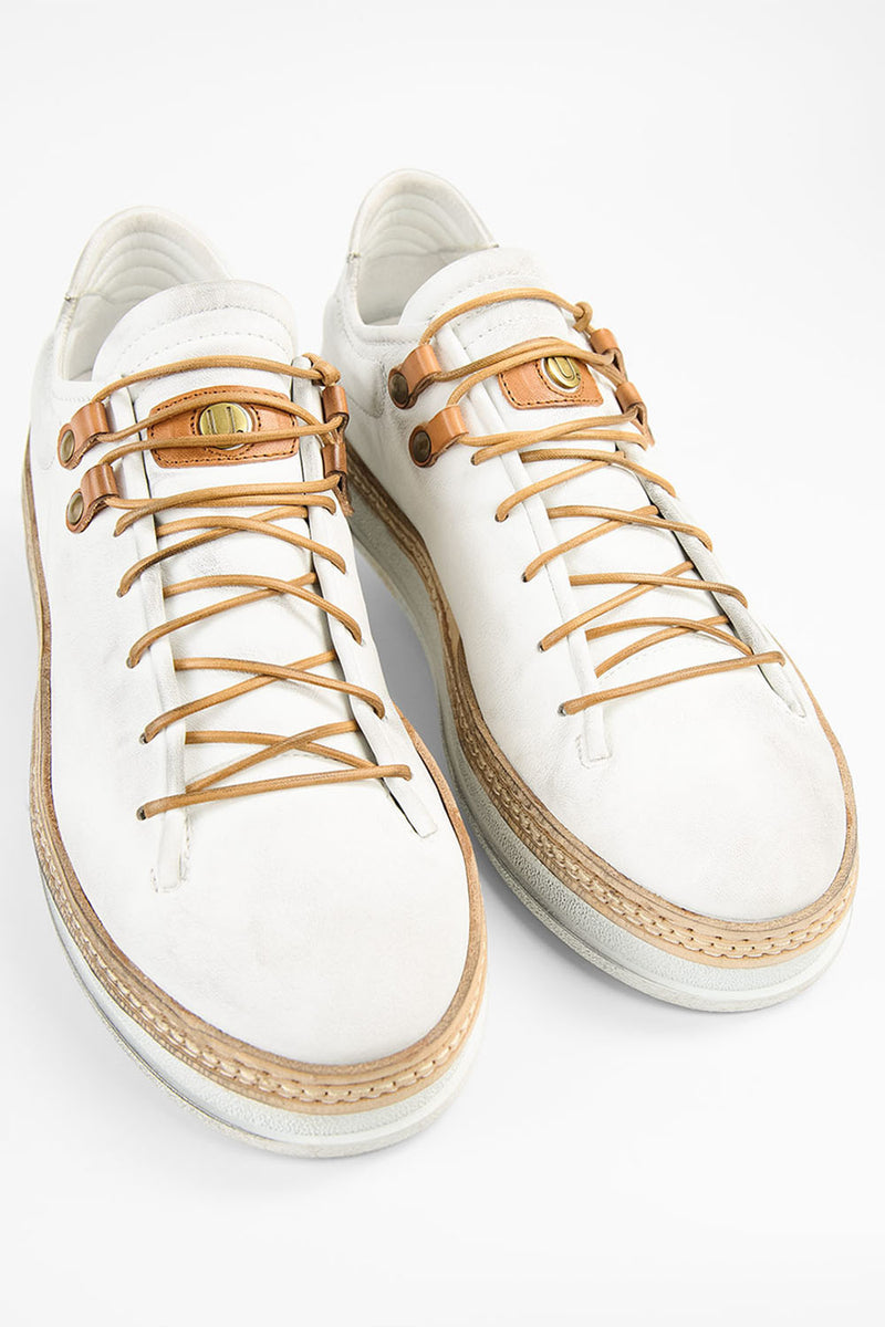 COLE white welted distressed loop sneakers.