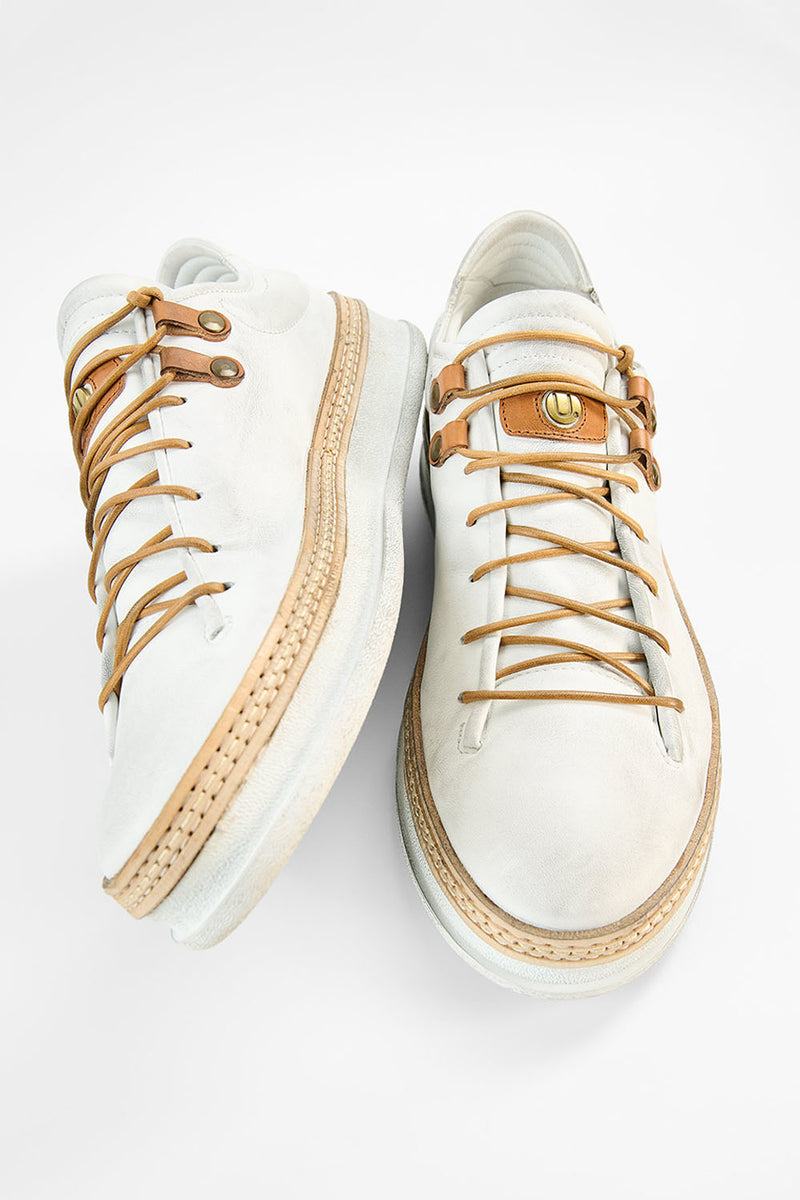 COLE white welted distressed loop sneakers.