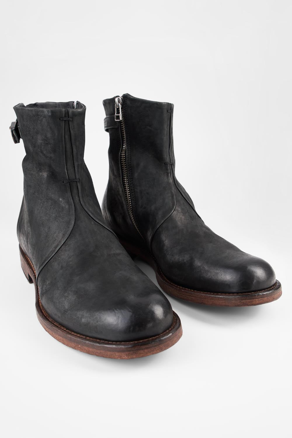 EYTON matte-black laceless ankle boots.