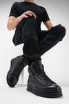 COLE rugged-black welted distressed high sneakers.