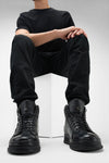 COLE rugged-black welted distressed high sneakers.