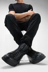 COLE rugged-black welted distressed high sneakers.