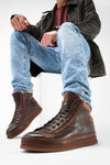 COLE cognac welted distressed high sneakers.