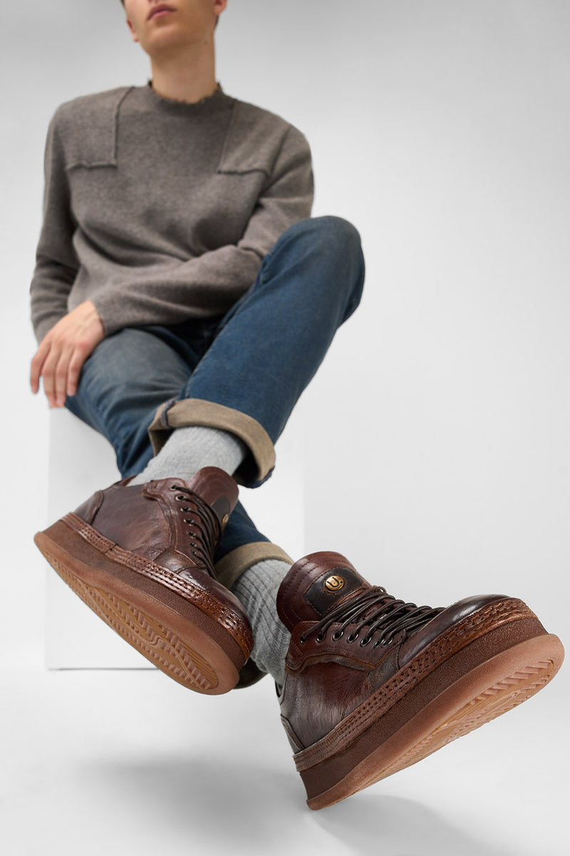 COLE cognac welted distressed sneakers.