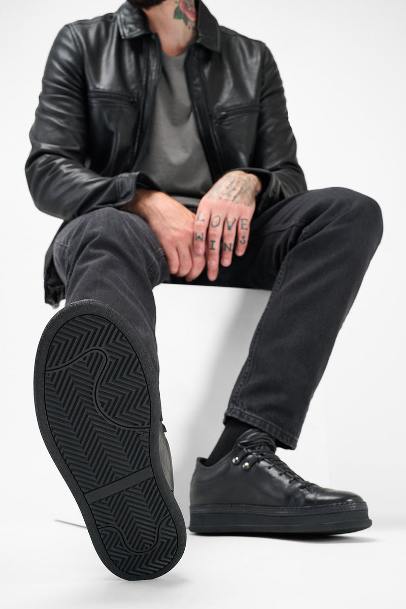 COLE rugged-black welted distressed loop sneakers.