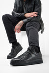 COLE rugged-black welted distressed loop sneakers.