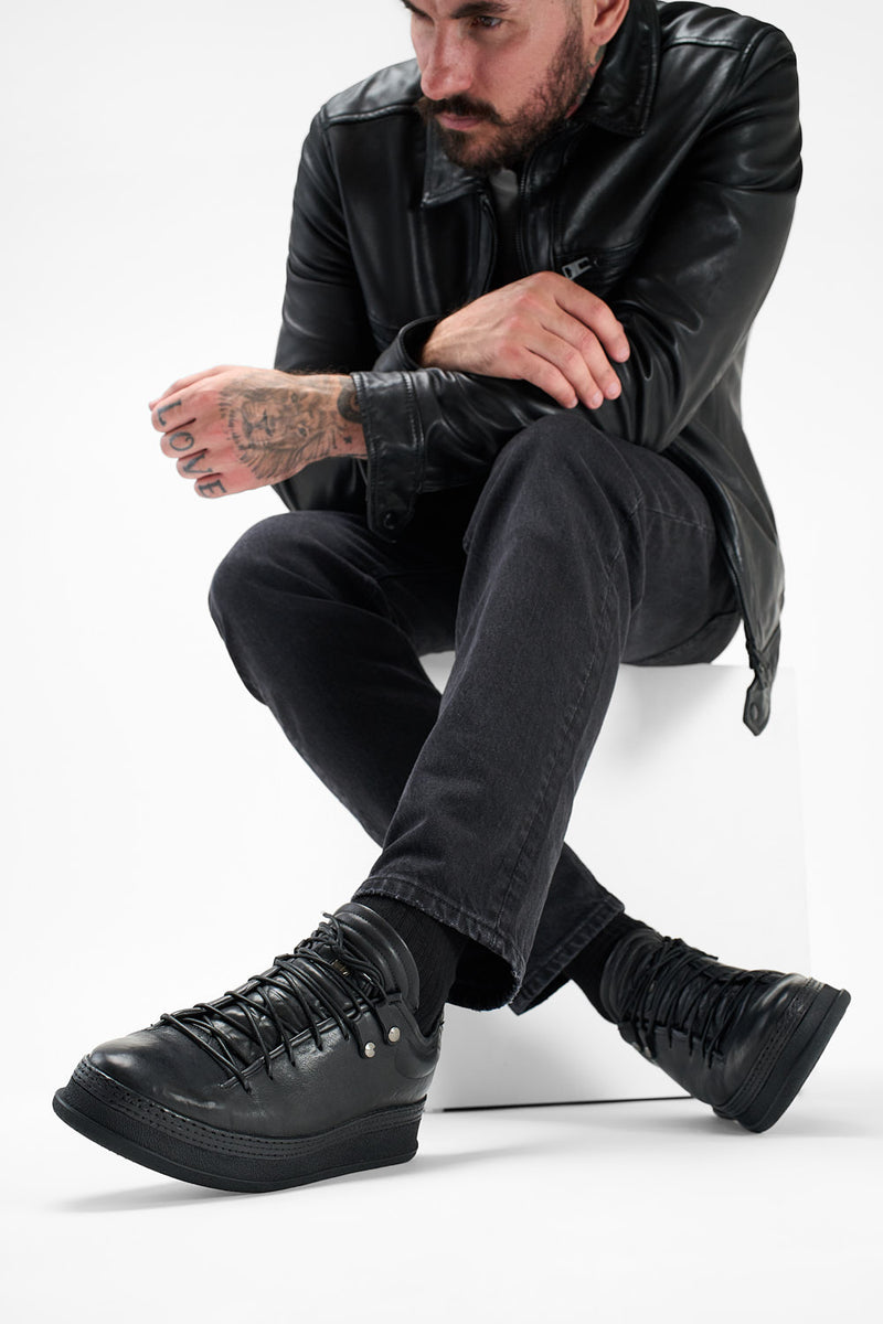 COLE rugged-black welted distressed sneakers.