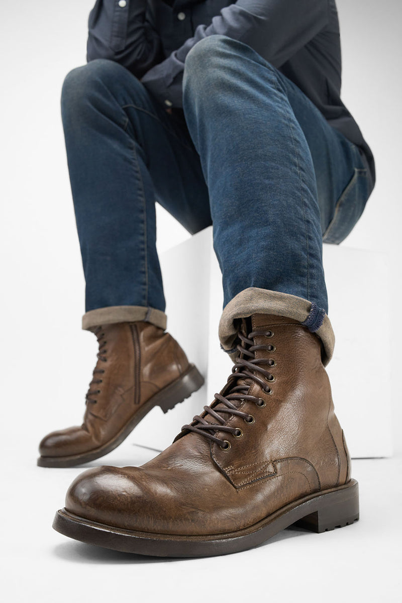 CURZON husk-brown military boots.