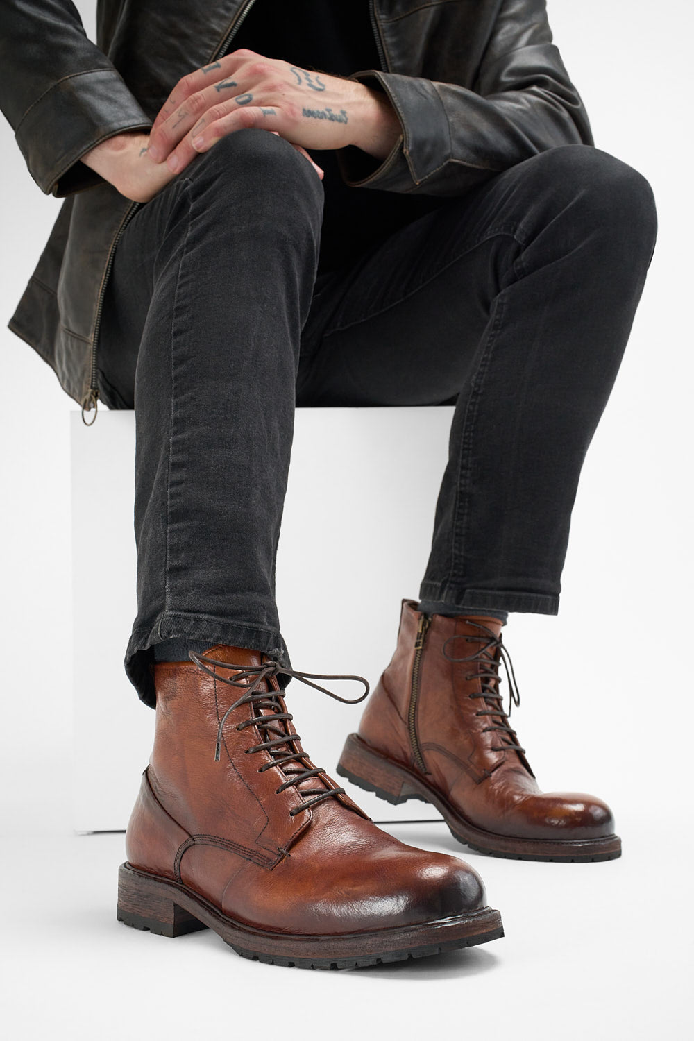 ROWLEY cognac folded lace up boots.