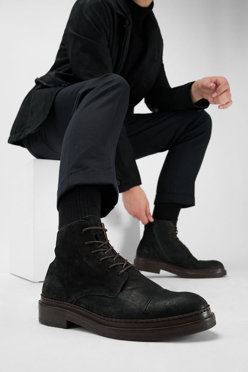 YALE distressed-black welted derby lace up boots.