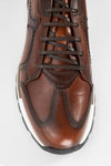 OWEN cocoa-brown triple stitched wingtip patina runners.