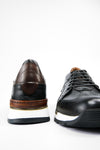 OWEN tuxedo-black triple stitched wingtip patina runners.