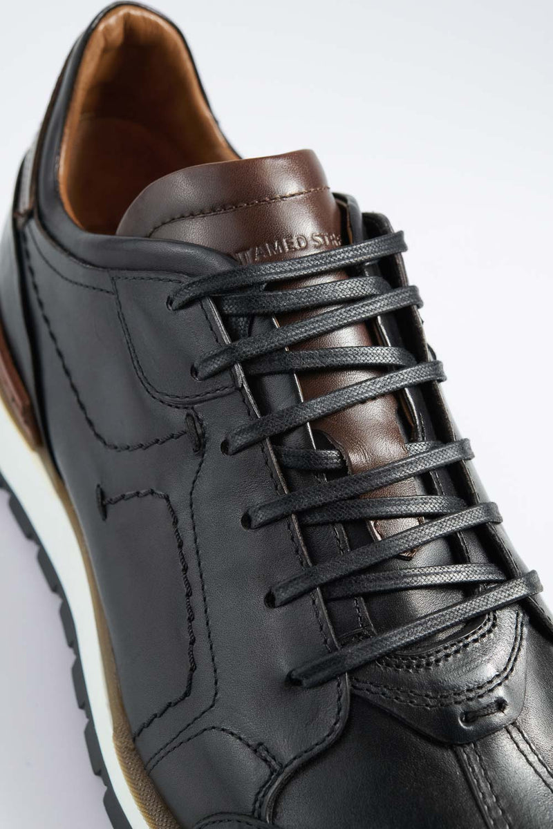 OWEN tuxedo-black triple stitched wingtip patina runners.