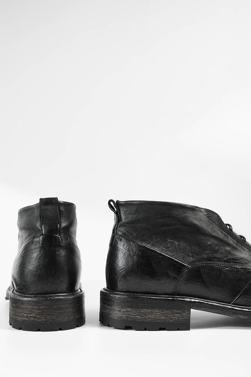 ROWLEY coal-black folded chukka boots.