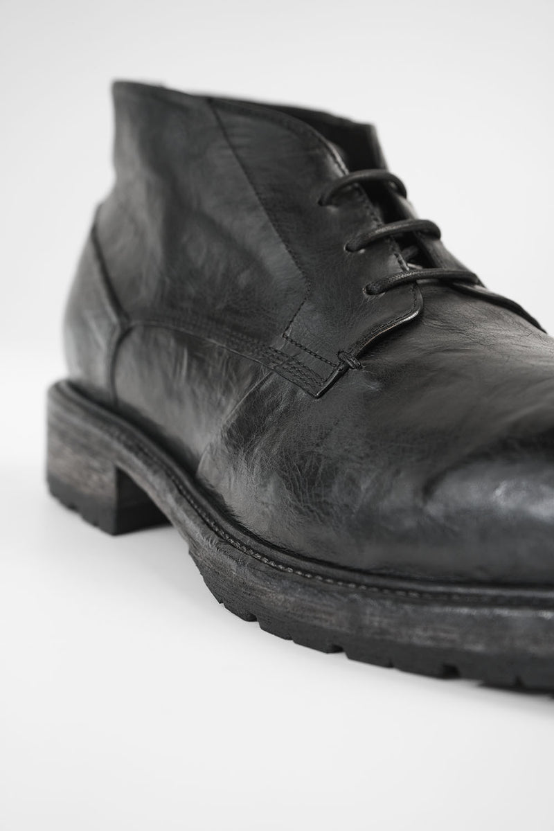 ROWLEY coal-black folded chukka boots.