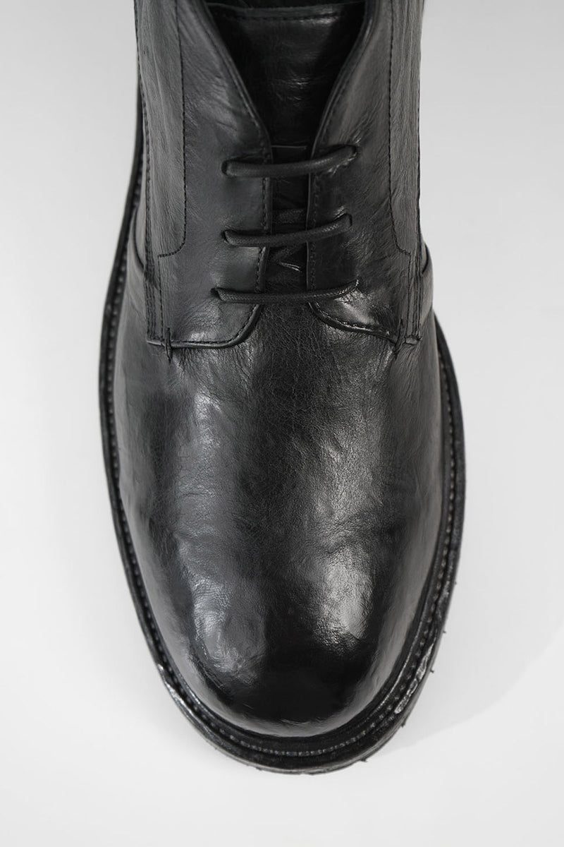 ROWLEY coal-black folded chukka boots.