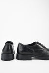 ROWLEY coal-black folded derby shoes.