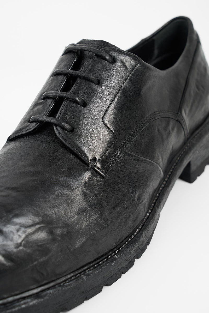 ROWLEY coal-black folded derby shoes.