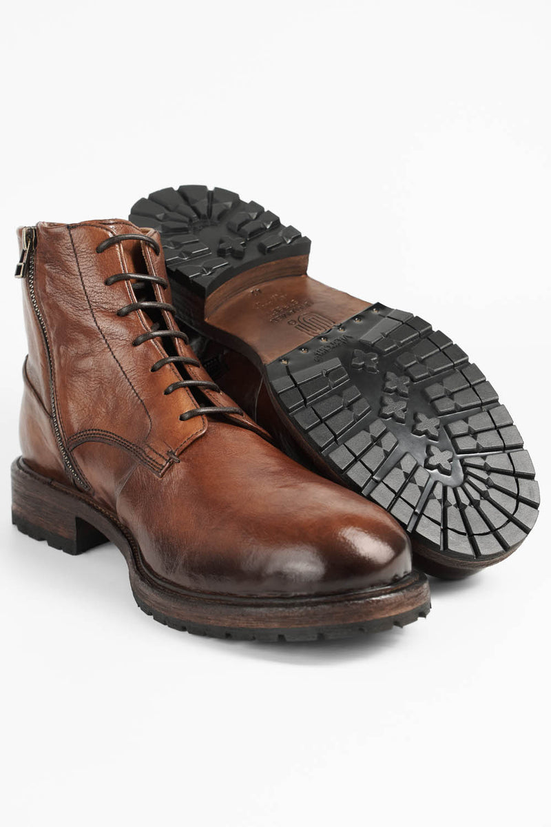 ROWLEY cognac folded lace up boots.