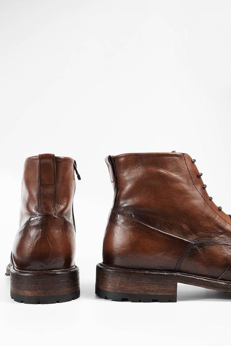 ROWLEY cognac folded lace up boots.