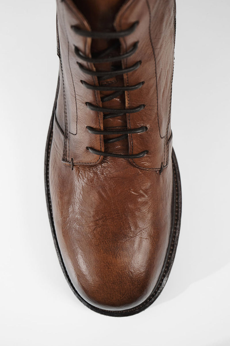 ROWLEY cognac folded lace up boots.