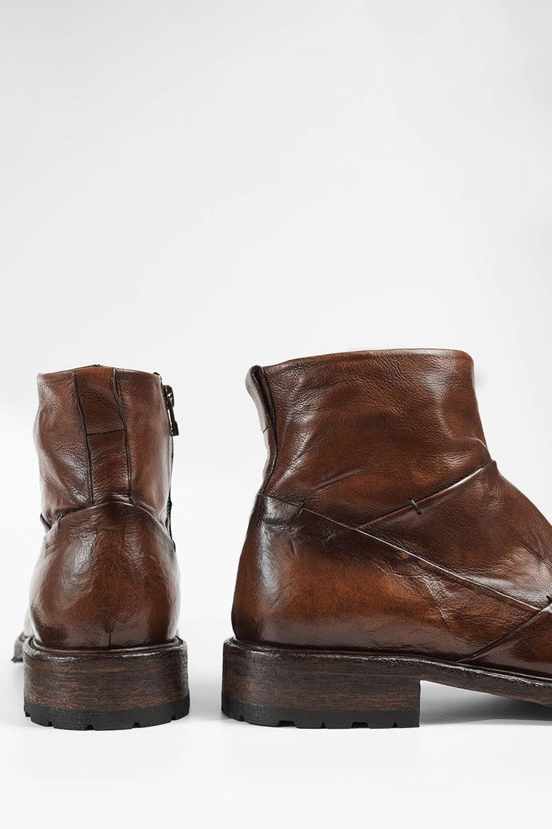 ROWLEY cognac folded laceless boots.