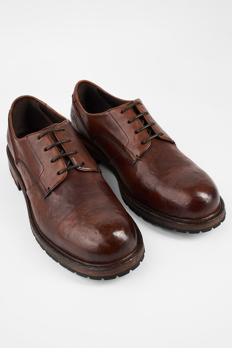 ROWLEY cognac folded derby shoes.