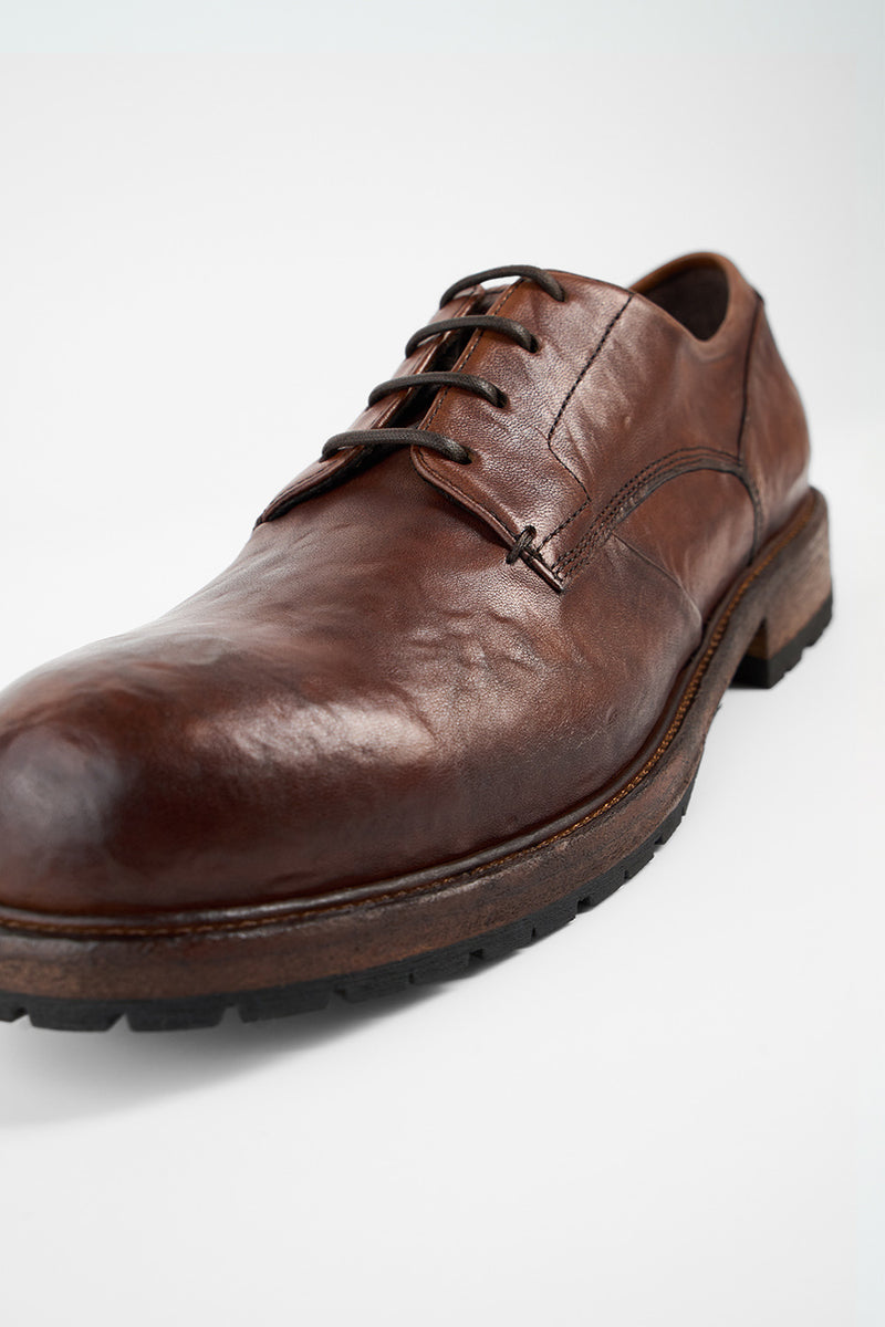 ROWLEY cognac folded derby shoes.