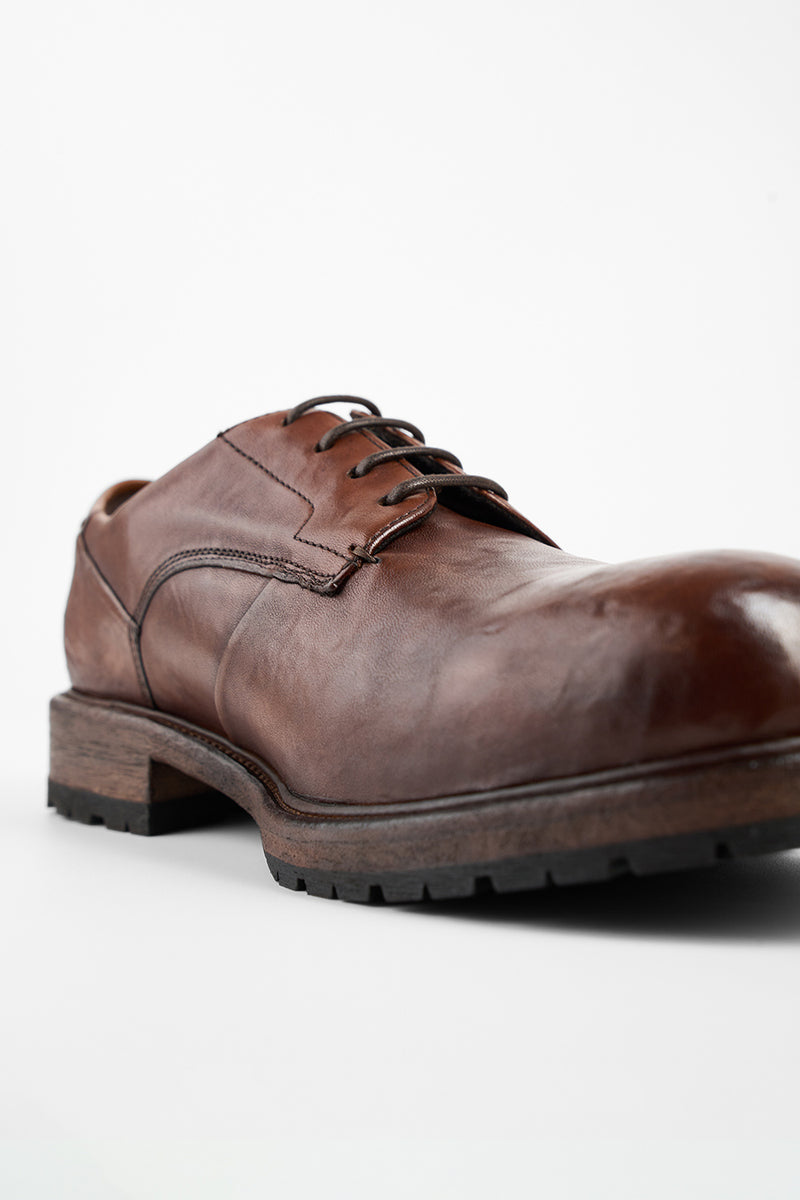 ROWLEY cognac folded derby shoes.