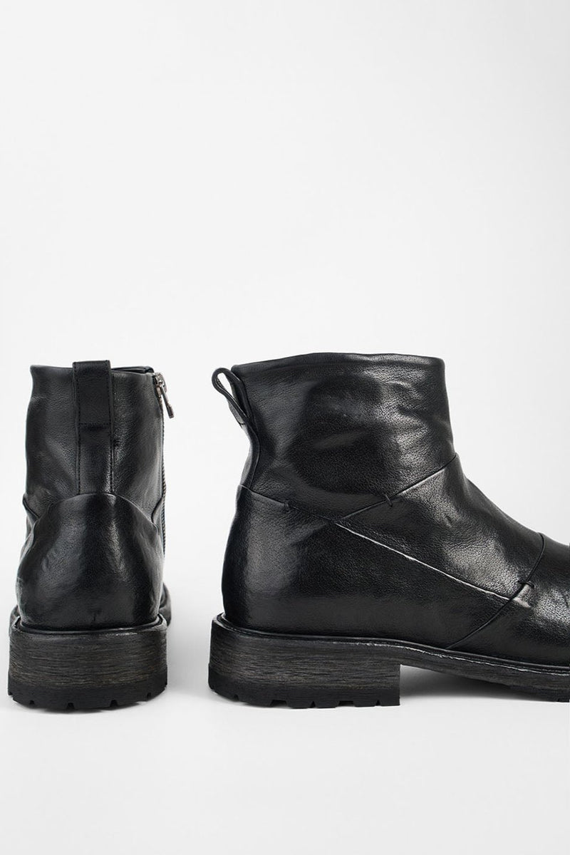 ROWLEY jet-black folded laceless boots.