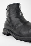 ROWLEY jet-black folded laceless boots.