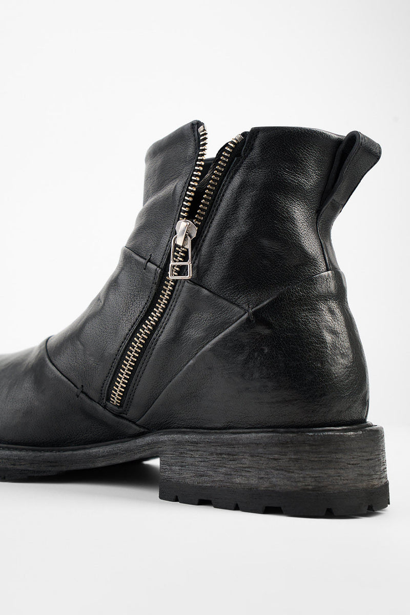 ROWLEY jet-black folded laceless boots.