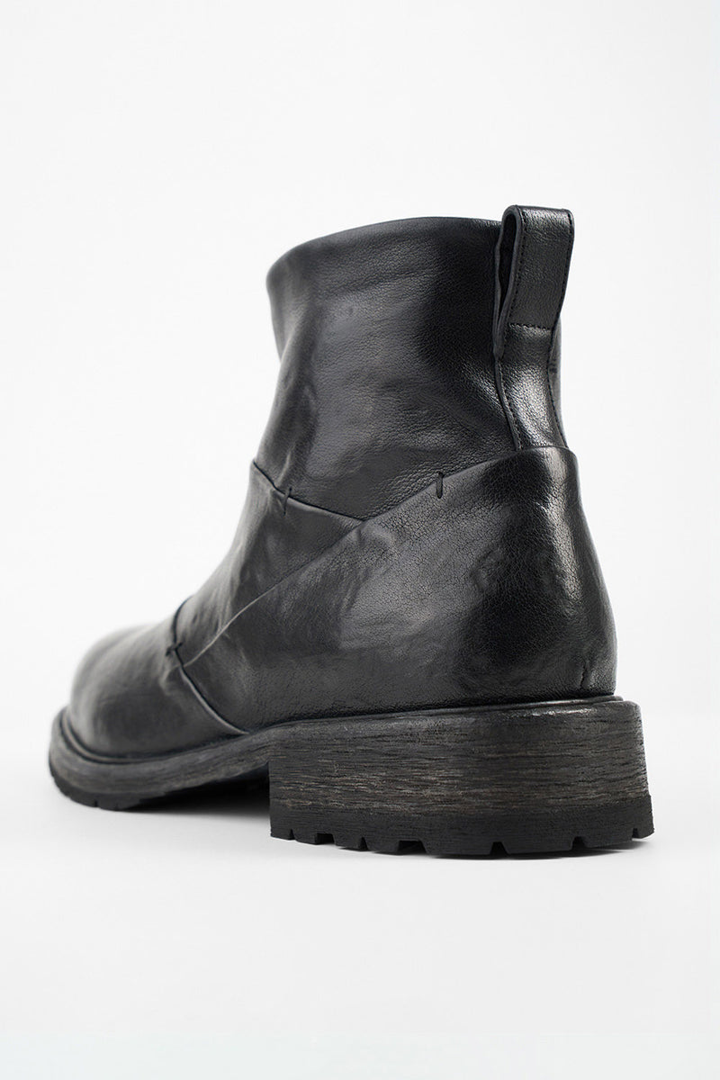 ROWLEY jet-black folded laceless boots.