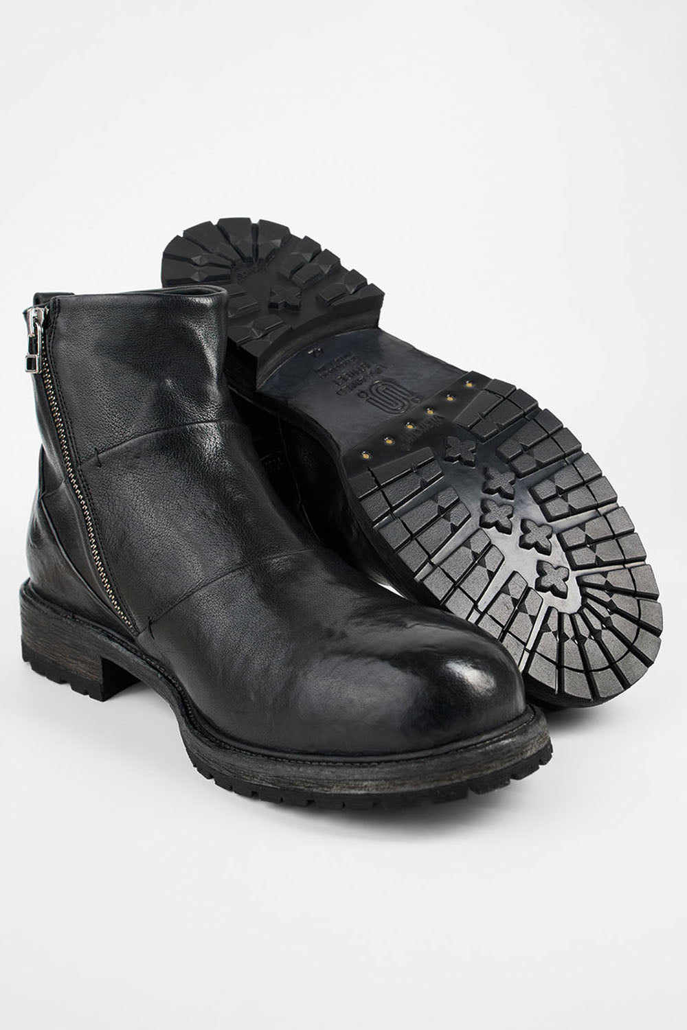 ROWLEY jet-black folded laceless boots.