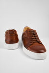 SKYE cognac studded patina sneakers.