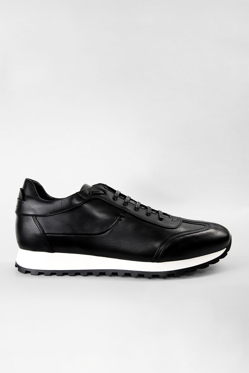 SOHO tuxedo-black wingtip runners.