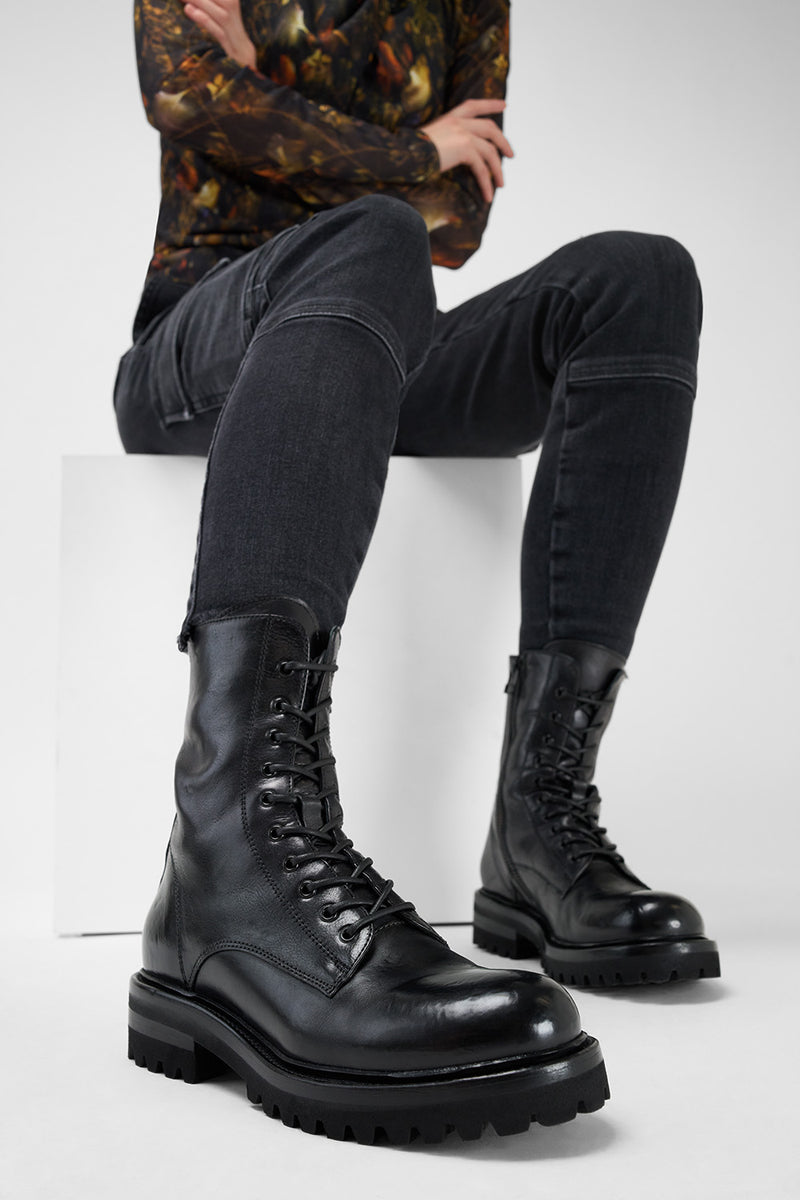 CAMDEN jet-black military boots.