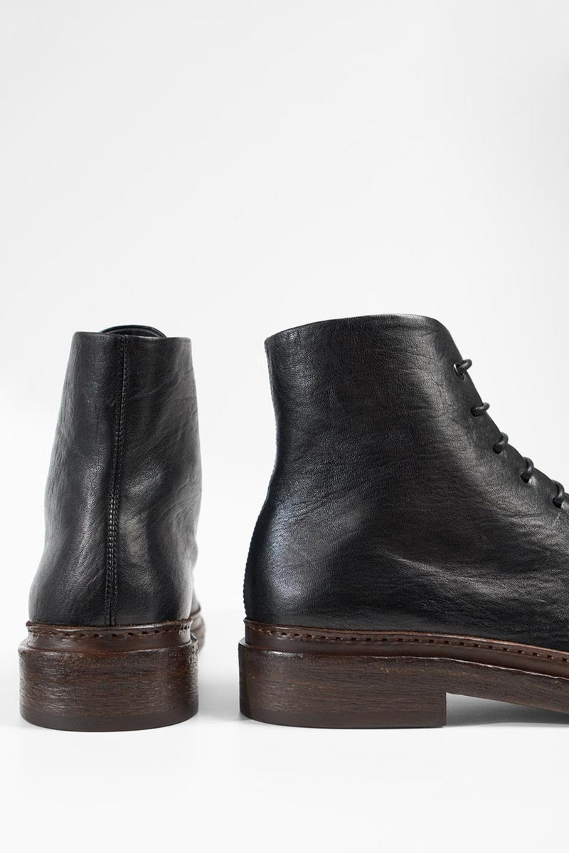 YALE tuxedo-black welted derby lace up boots.