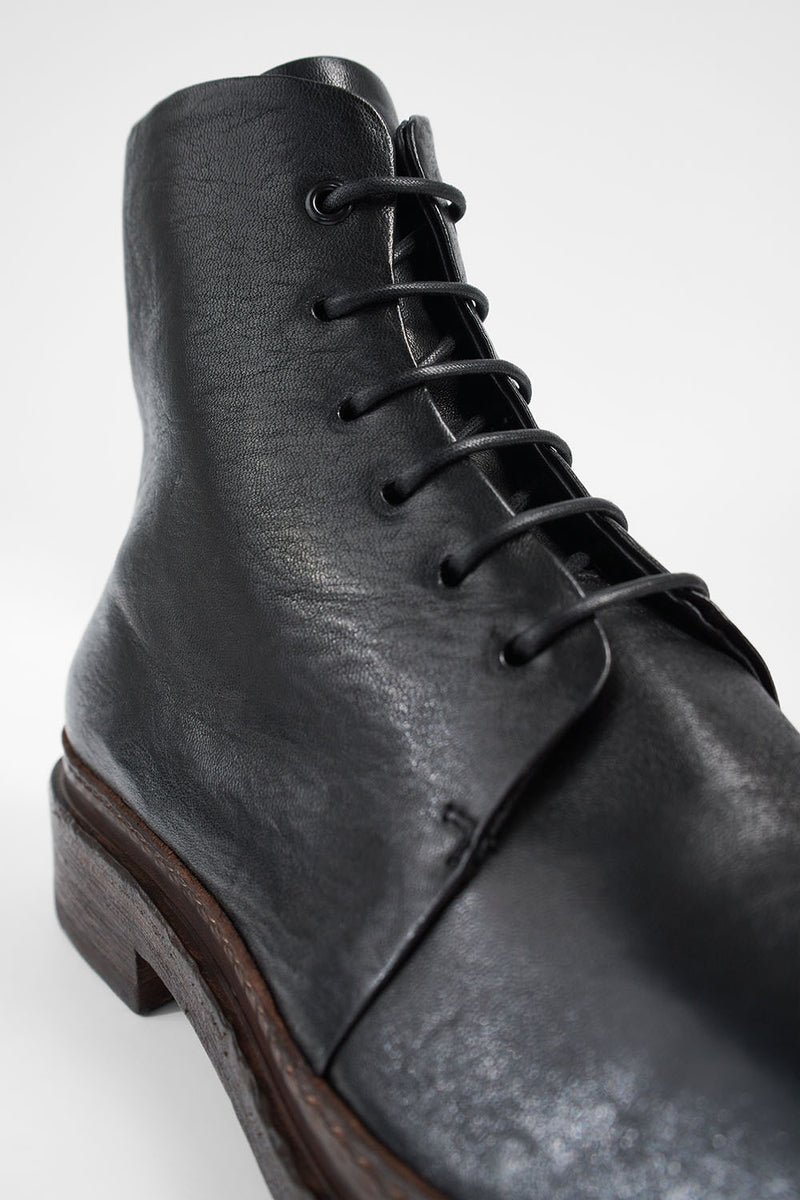 YALE tuxedo-black welted derby lace up boots.